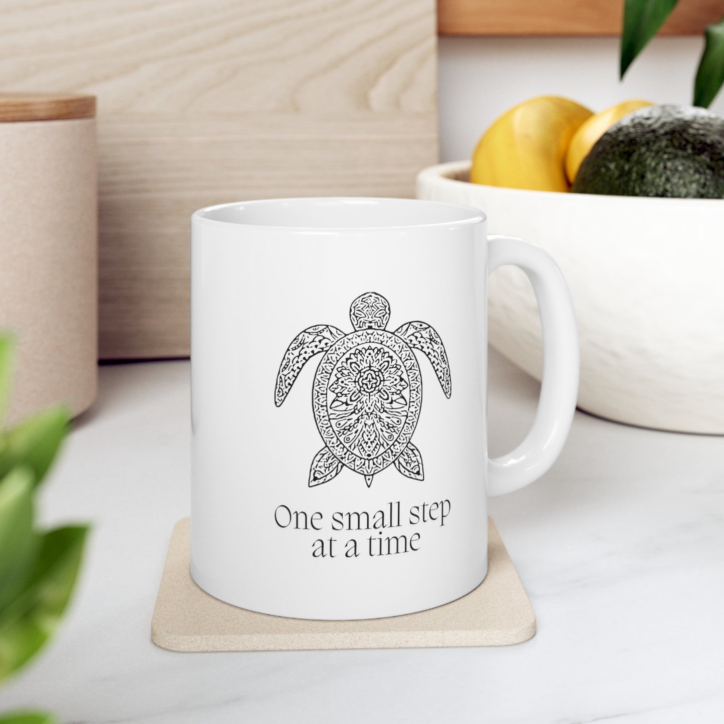 Embrace the journey with this motivational 11-ounce ceramic mug. The mandala pattern wraps around the mug, and a serene turtle image graces both sides. Made from premium quality white ceramic, it’s microwave and dishwasher-safe. Whether you’re sipping coffee, tea, or hot cocoa, let this mug remind you that progress happens one step at a time.