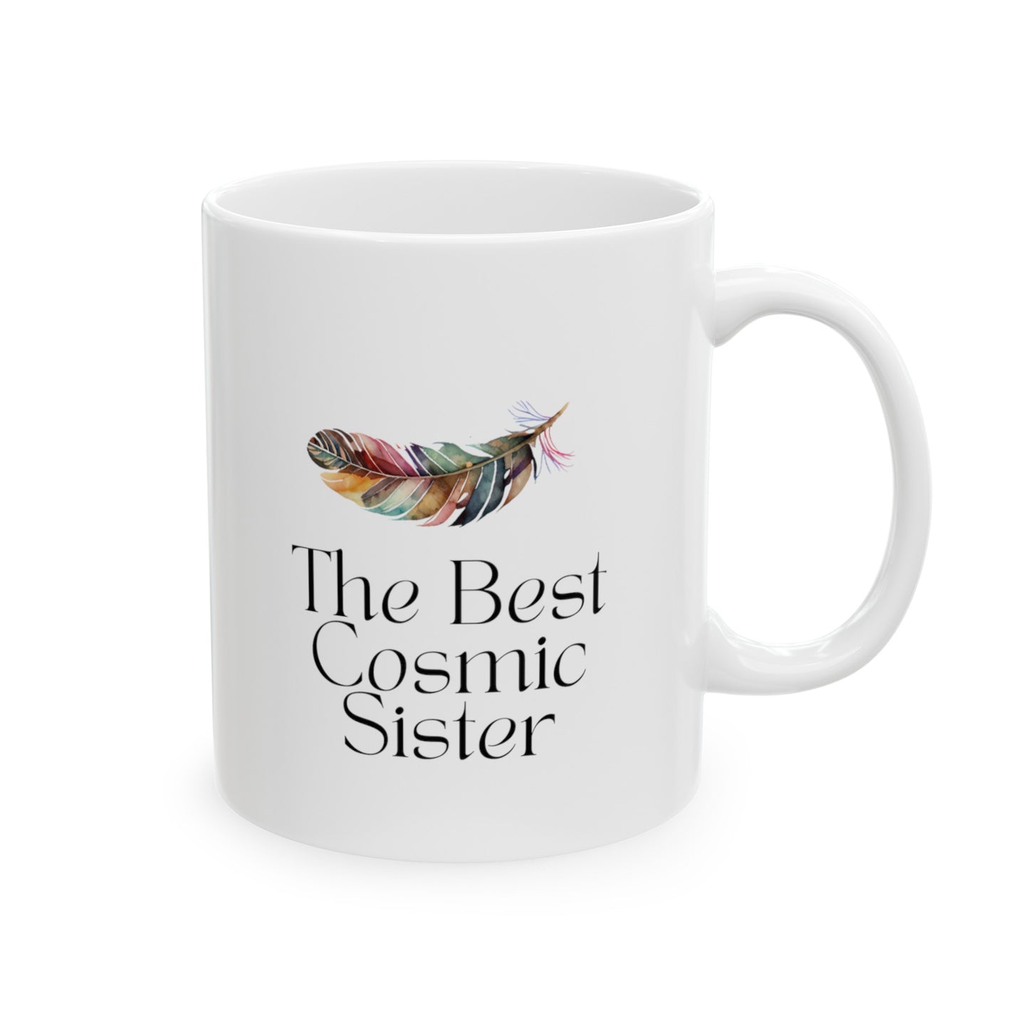 White ceramic mug with the text The best cosmic sister and with the image of multicolor feather. Size of 11 oz.