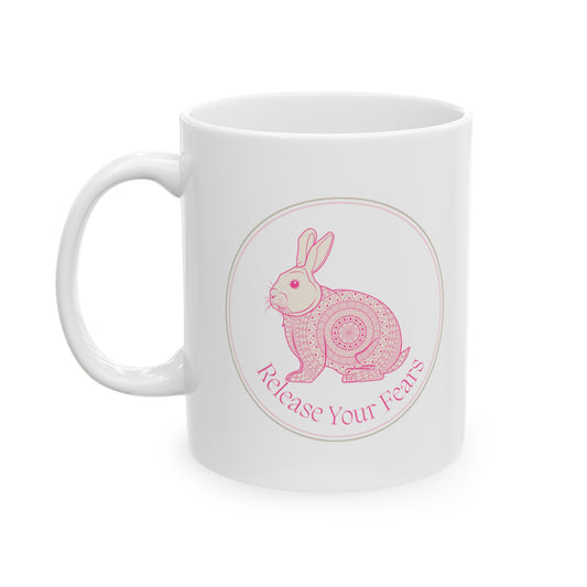 Embrace tranquility with this enchanting 11-ounce ceramic mug. The intricate mandala pattern wraps around the mug, and a serene rabbit image graces both sides. Crafted from premium quality white ceramic, it’s microwave and dishwasher-safe. Whether you’re sipping coffee, tea, or hot cocoa, let this mug remind you to release your fears and find peace in each sip. 