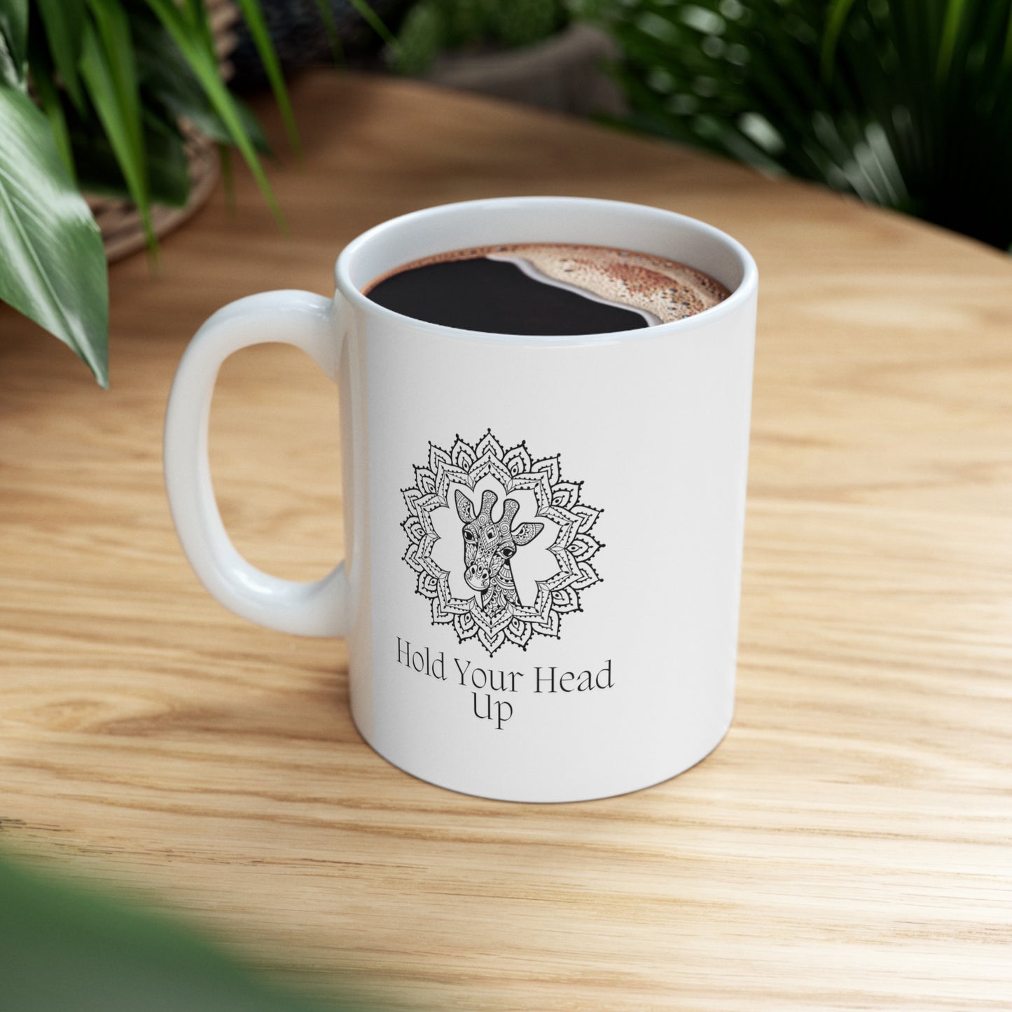 Embrace the grace of the savannah with this charming 11-ounce ceramic mug. The majestic giraffe, adorned with mandala patterns, gazes out from both sides of the mug.