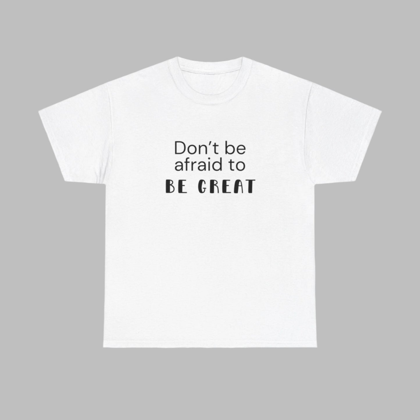 The "Don't Be Afraid To Be Great" T-Shirt is the best t-shirt to your collection. White T-shirt designed for those who embrace the challenge of stepping out of their comfort zone, this shirt is a daily reminder to strive for greatness. Crafted from premium, soft cotton, it ensures maximum comfort and durability for everyday wear. Embrace the courage to be exceptional. 