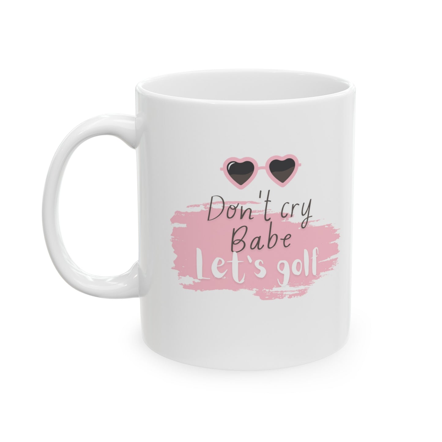 Brighten your day and lift your spirits with the "Don't Cry Babe, Let's Golf" golf-themed ceramic mug. This 11oz white mug is designed for golf enthusiasts who appreciate a bit of humor and motivation with their morning brew. Perfect for enjoying coffee, tea, or any favorite beverage, this mug brings a touch of fun to your daily routine.