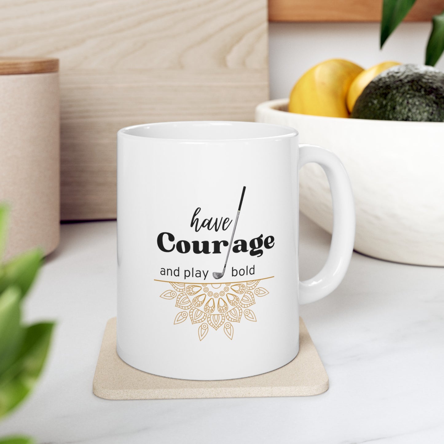 The "Have Courage and Play Bold" golf-themed ceramic mug with the image of mandala and golf club. This 11oz white mug is the perfect companion for every golf enthusiast, providing a daily dose of inspiration with every sip. 