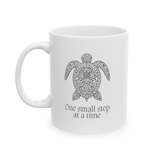 Embrace the journey with this motivational 11-ounce ceramic mug. The mandala pattern wraps around the mug, and a serene turtle image graces both sides. Made from premium quality white ceramic, it’s microwave and dishwasher-safe. Whether you’re sipping coffee, tea, or hot cocoa, let this mug remind you that progress happens one step at a time.