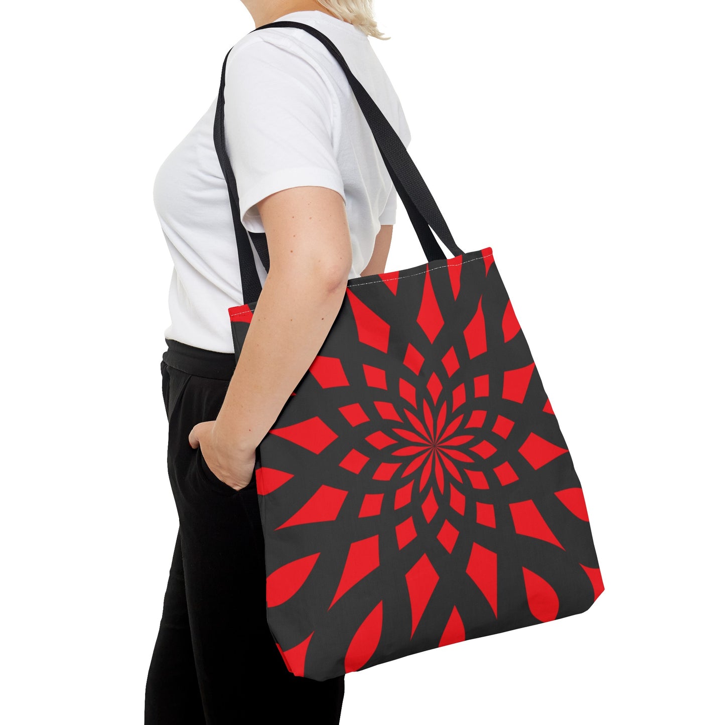 Red tote bag with black handles. Black pattern of mandala like. This size is LARGE. Made with 100% polyester. It is highly durable and perfect for everyday use. A bag is non-woven laminate inside, cotton handle, and are available in 3 sizes, 1x large storage compartment.