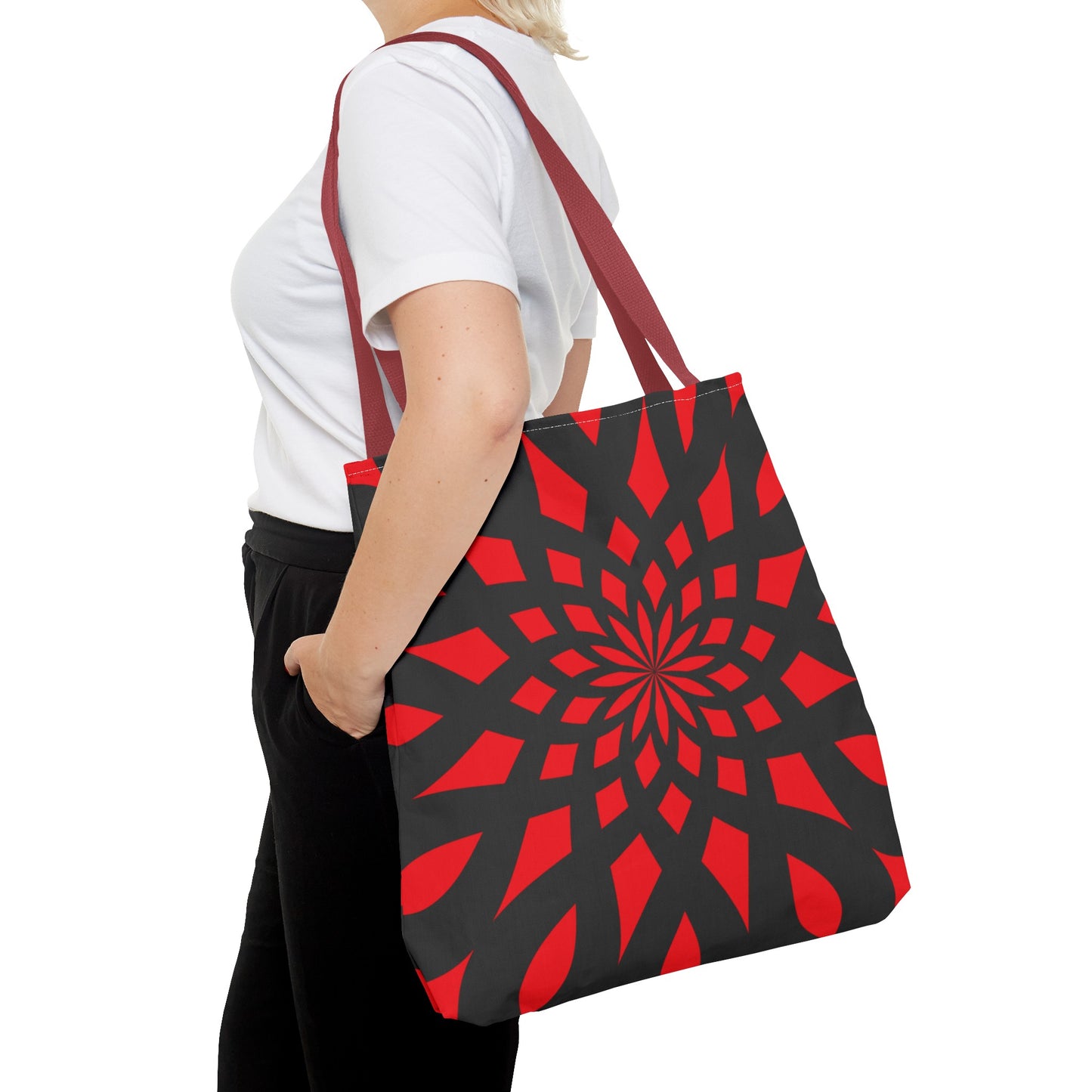 Red tote bag with red handles. Black pattern of mandala like. This size is LARGE. Made with 100% polyester. It is highly durable and perfect for everyday use. A bag is non-woven laminate inside, cotton handle, and are available in 3 sizes, 1x large storage compartment.