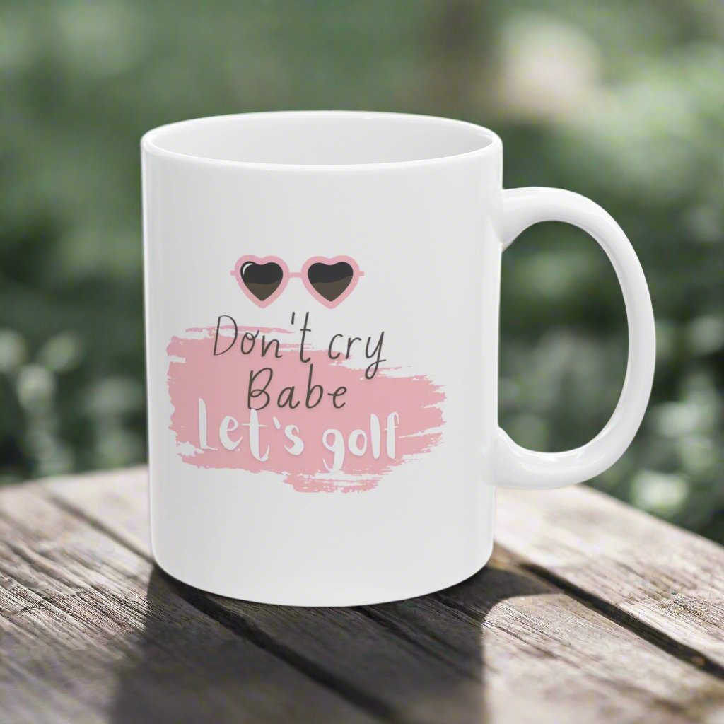 Don't Cry Babe, Let's Golf, Golf themed White Ceramic Mug, 11oz with the image of pink heart shaped sunglasses.