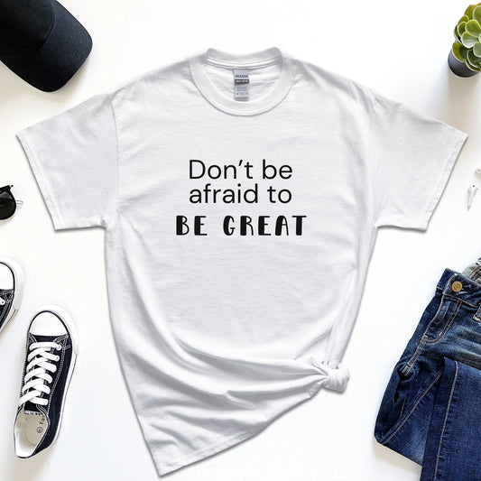 The "Don't Be Afraid To Be Great" T-Shirt is the best t-shirt to your collection. White T-shirt designed for those who embrace the challenge of stepping out of their comfort zone, this shirt is a daily reminder to strive for greatness. Crafted from premium, soft cotton, it ensures maximum comfort and durability for everyday wear. Embrace the courage to be exceptional. 